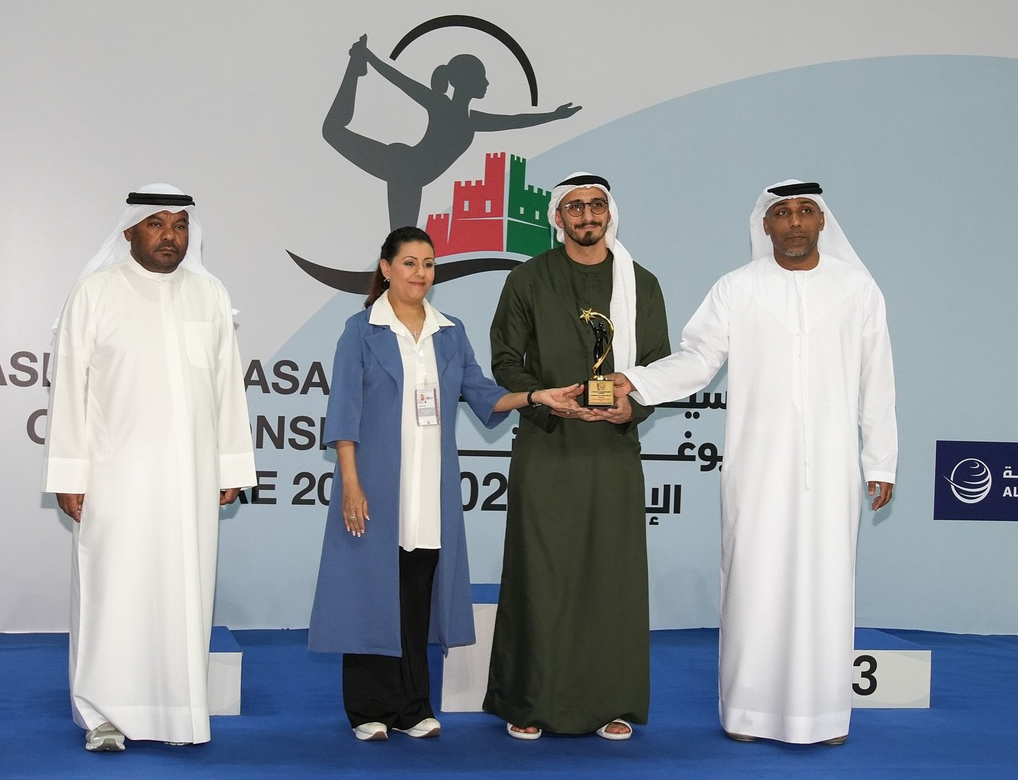 Mohammed F. Mostafa receiving an award from the UAE yoga committee